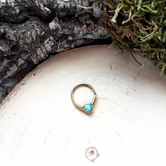 Simple Golden Opal Piercing